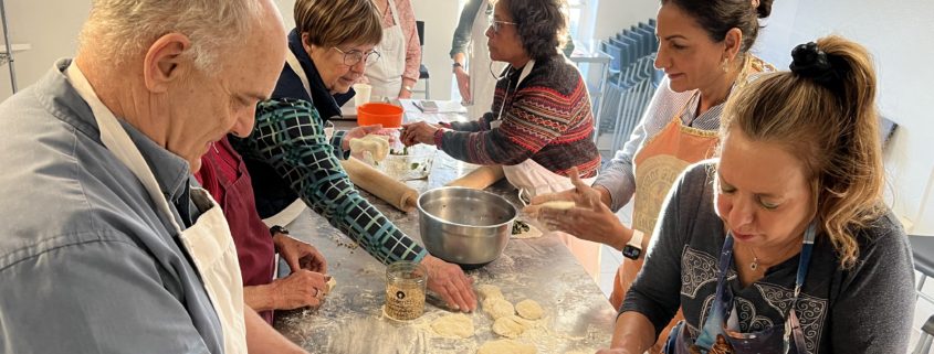 Cooking Class Students Rolling Dough