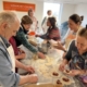 Cooking Class Students Rolling Dough