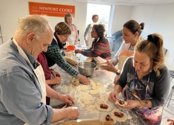 Cooking Class Students Rolling Dough
